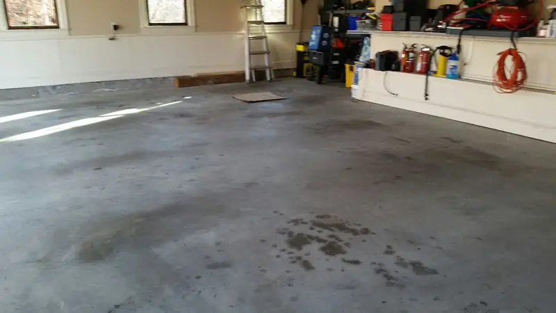Oil stained concrete garage floor