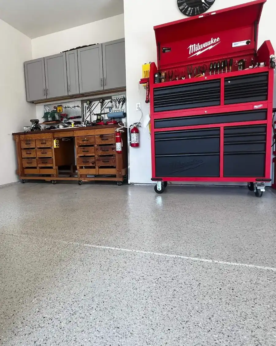 Finished garage floor below tool storage